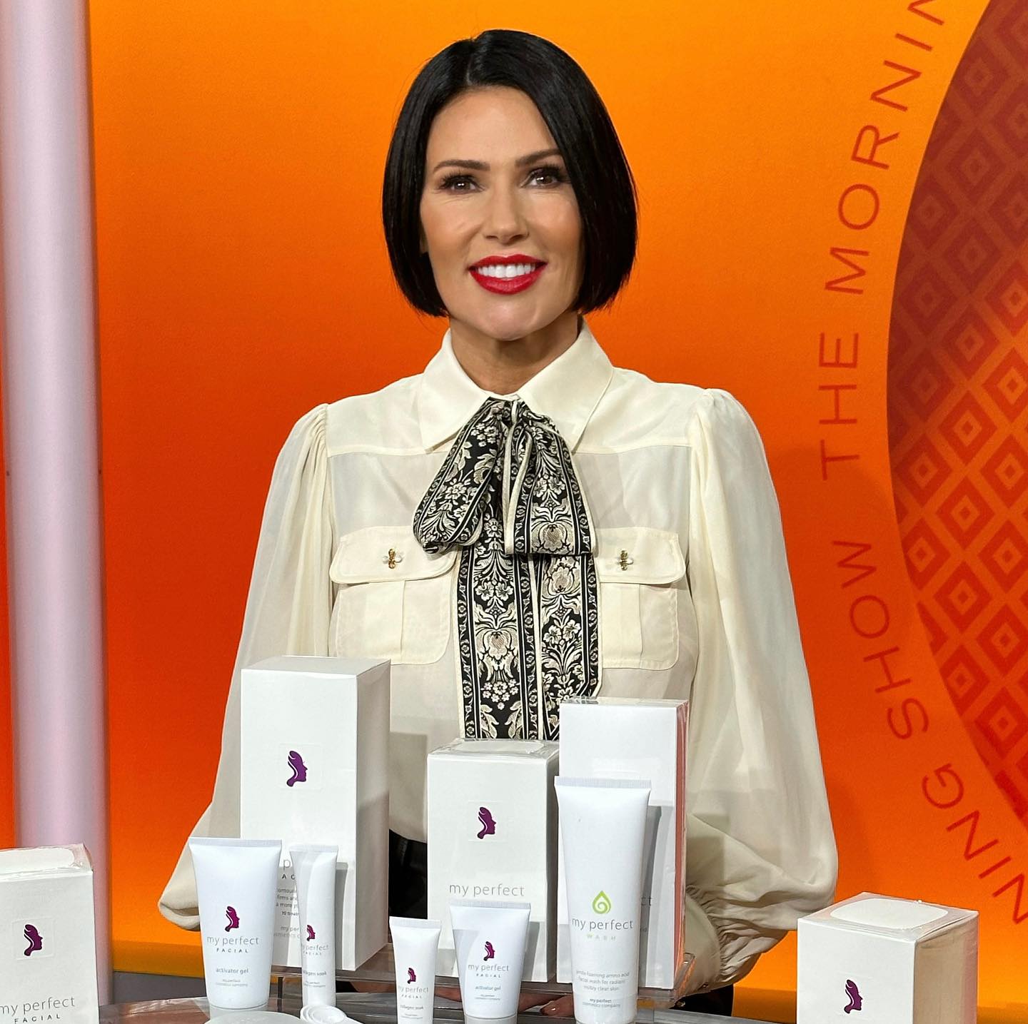 My Perfect Cosmetics founder with the product range on TV